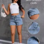 High-waisted distressed denim shorts